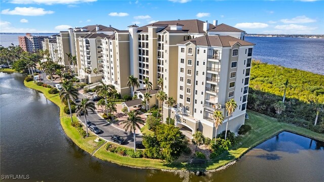 view of building exterior with a water view