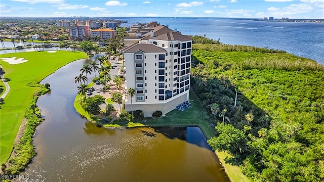 drone / aerial view featuring a view of city and a water view