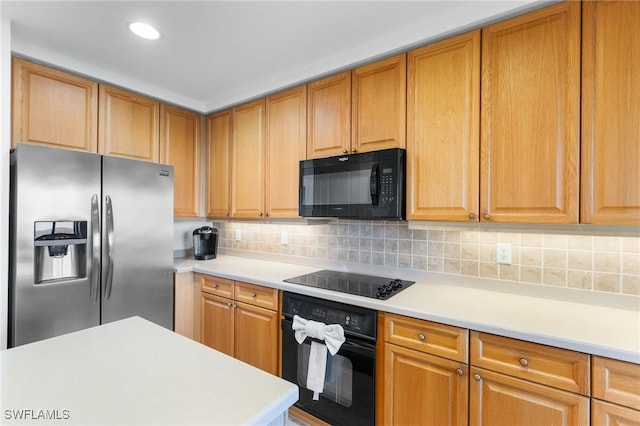 kitchen featuring backsplash and black appliances