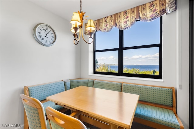 dining space featuring a notable chandelier and breakfast area