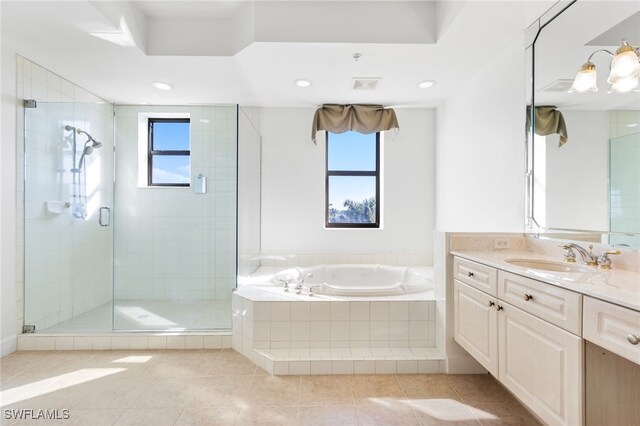 full bathroom featuring a stall shower, tile patterned floors, a garden tub, vanity, and recessed lighting