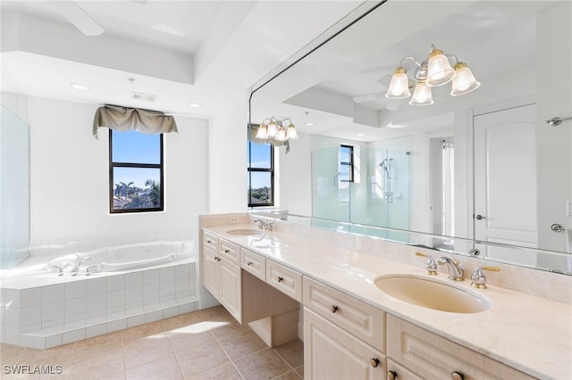 bathroom with ceiling fan, tile patterned flooring, vanity, a tray ceiling, and shower with separate bathtub