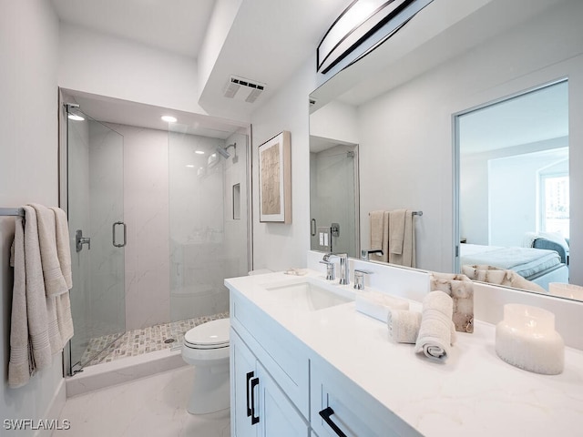 bathroom with an enclosed shower, vanity, and toilet