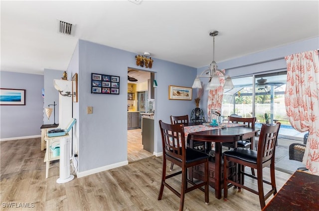 dining space featuring light hardwood / wood-style flooring