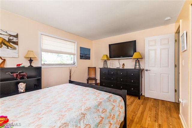 bedroom with light wood-type flooring