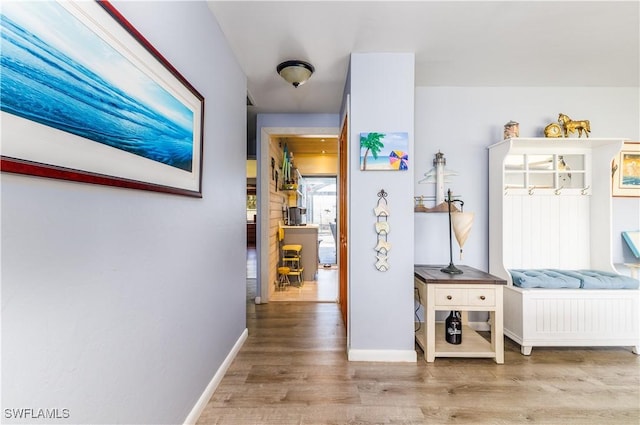 mudroom with light hardwood / wood-style floors