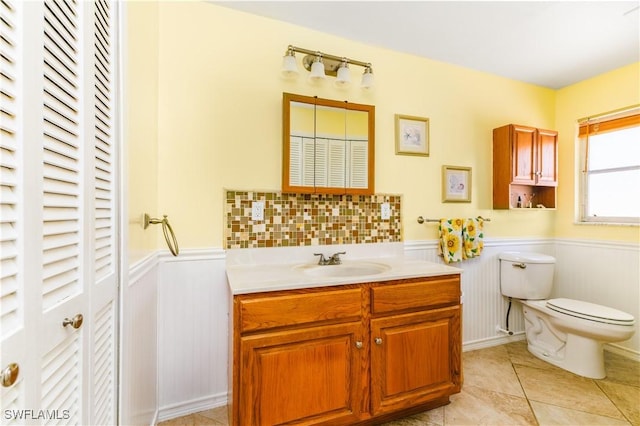 bathroom with vanity, tile patterned floors, and toilet