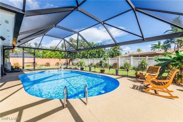 view of swimming pool featuring glass enclosure, a shed, and a patio