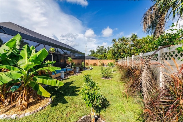 view of yard with glass enclosure