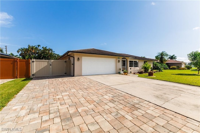 ranch-style home featuring a garage and a front yard