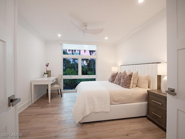 bedroom featuring light hardwood / wood-style floors and ceiling fan