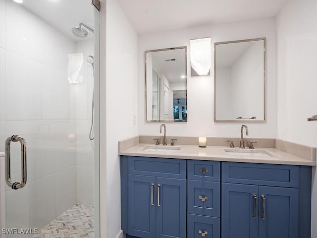 bathroom with vanity and a tile shower