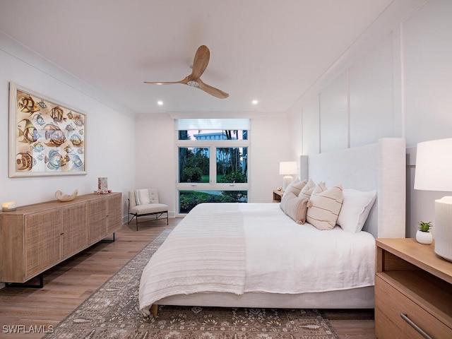 bedroom featuring dark hardwood / wood-style floors and ceiling fan