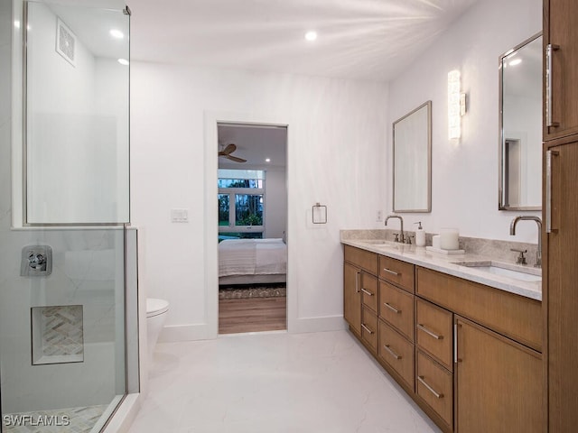 bathroom featuring walk in shower, vanity, and toilet