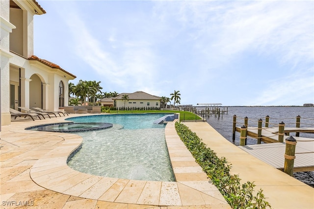 view of pool featuring a patio and a water view