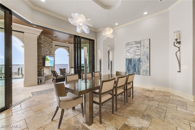 614 Coral Dr, Cape Coral, FL 33904 - dining space with crown molding, stone tile floors, recessed lighting, french doors, and baseboards