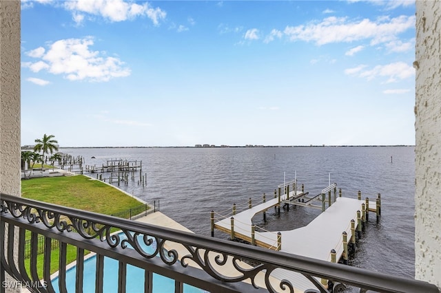 dock area featuring a yard and a water view