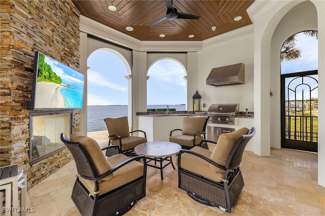 view of patio / terrace with exterior kitchen, area for grilling, ceiling fan, and sink