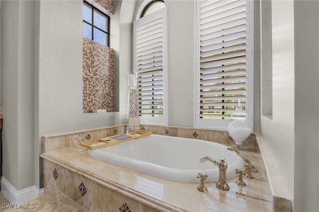 bathroom with tiled bath