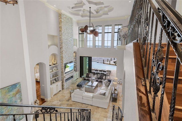 614 Coral Dr, Cape Coral, FL 33904 - living room with coffered ceiling, a towering ceiling, ornamental molding, and built in shelves