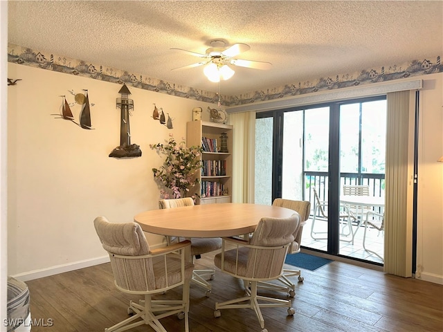 dining space with ceiling fan, a textured ceiling, and hardwood / wood-style floors