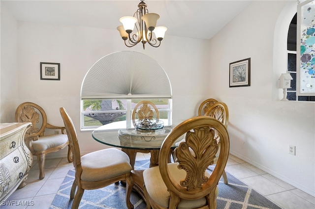 tiled dining space with an inviting chandelier