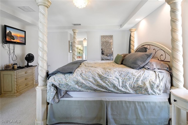 carpeted bedroom featuring ornate columns