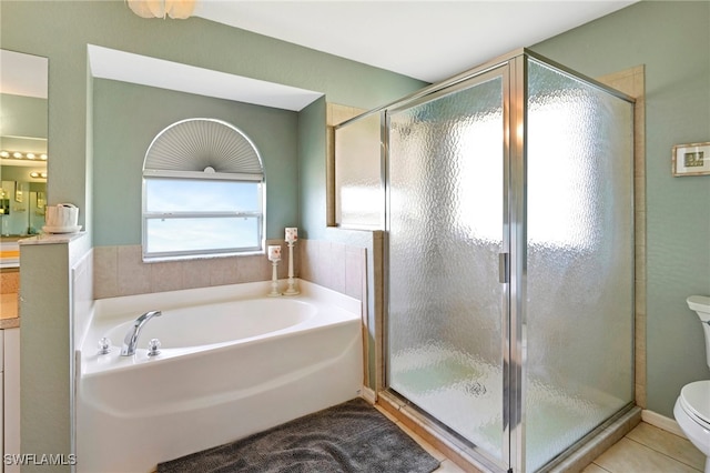 full bathroom with tile patterned flooring, vanity, toilet, and separate shower and tub