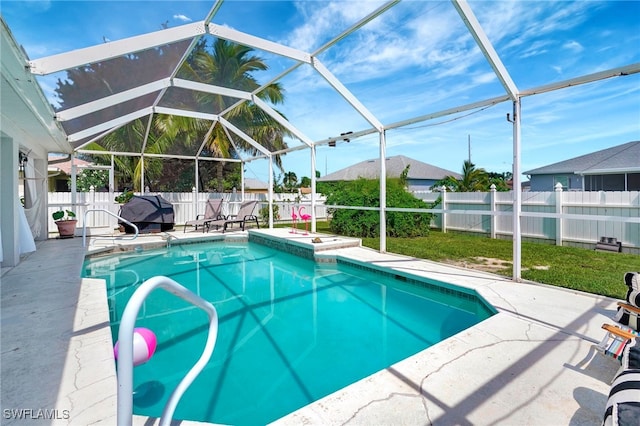 view of pool with a lanai and a patio