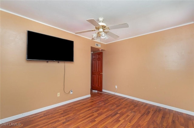 unfurnished living room featuring hardwood / wood-style flooring, crown molding, and ceiling fan