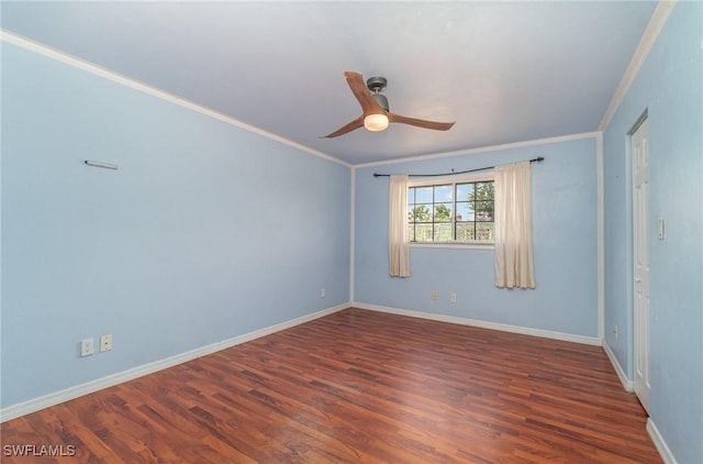 spare room featuring dark hardwood / wood-style flooring, crown molding, and ceiling fan