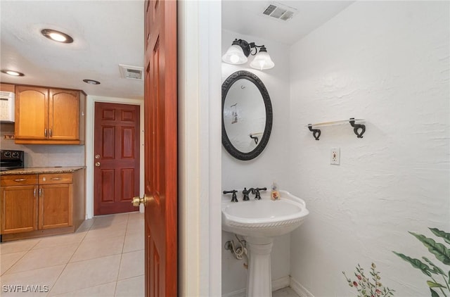 bathroom with tile patterned flooring