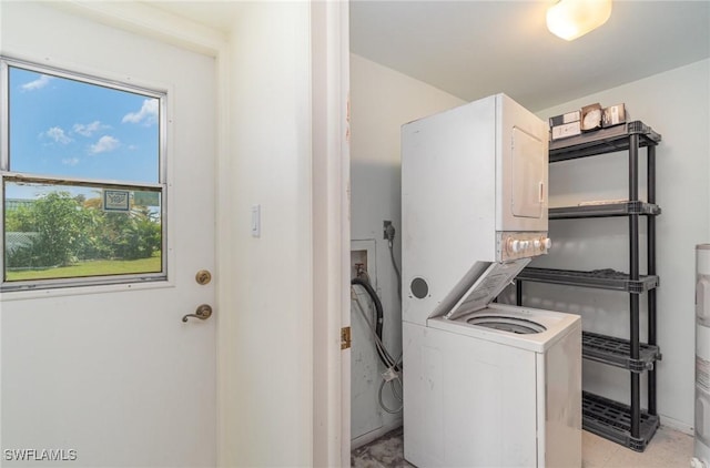 laundry area with stacked washer and dryer