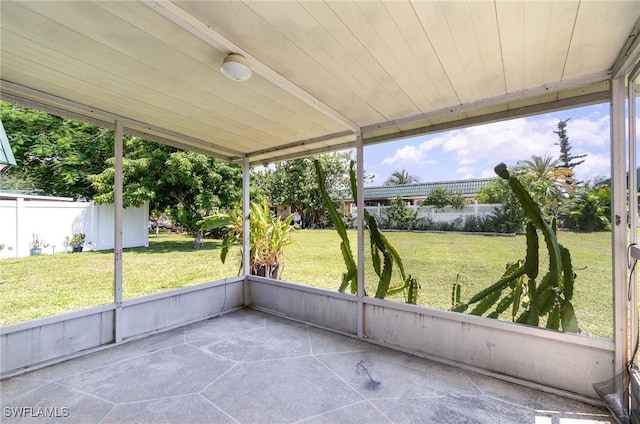 unfurnished sunroom featuring plenty of natural light and wooden ceiling