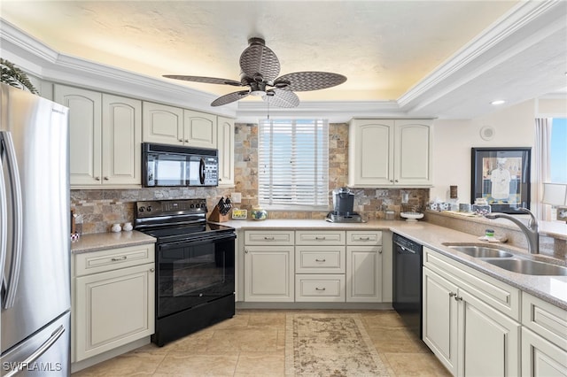 kitchen featuring sink, tasteful backsplash, ornamental molding, a raised ceiling, and black appliances