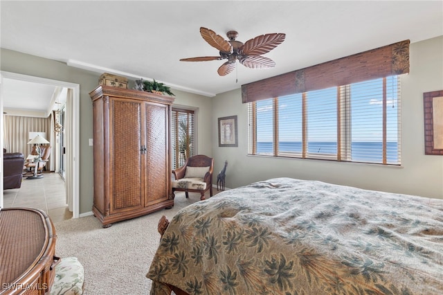 bedroom with light carpet and ceiling fan