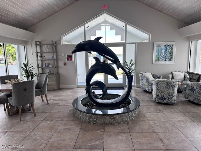 workout room featuring tile patterned flooring, vaulted ceiling, and wooden ceiling