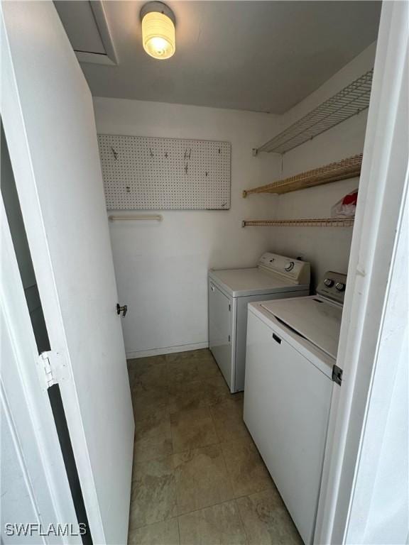 laundry area with independent washer and dryer