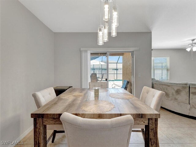 dining space with ceiling fan and light tile patterned floors