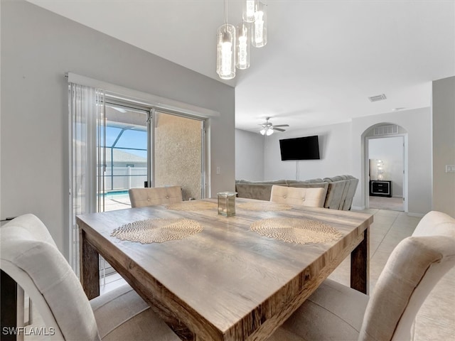 tiled dining room with ceiling fan