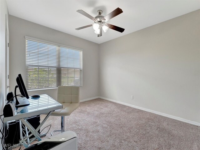 carpeted office with ceiling fan