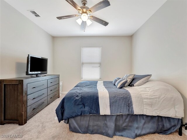 bedroom featuring light carpet and ceiling fan