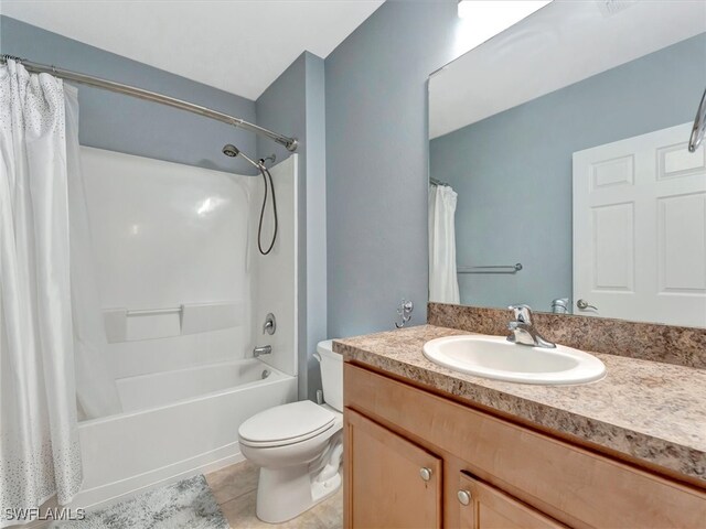 full bathroom featuring vanity, toilet, shower / tub combo with curtain, and tile patterned flooring