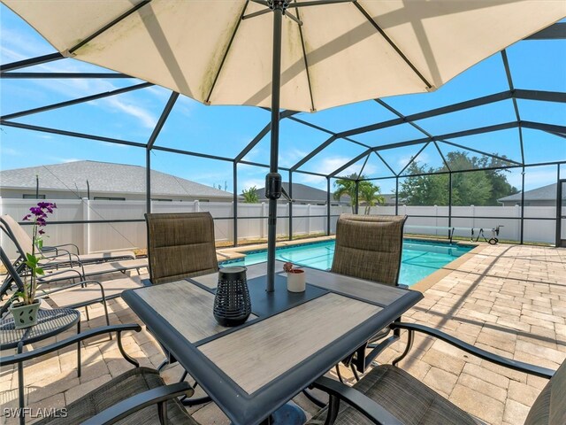 view of patio / terrace with a fenced in pool and a lanai