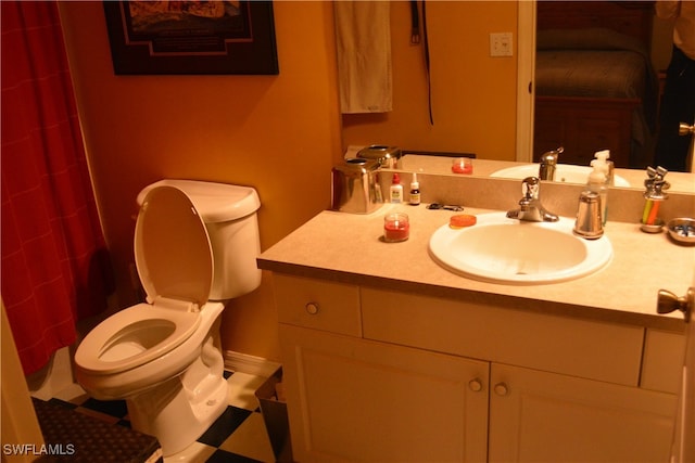 bathroom featuring toilet and vanity