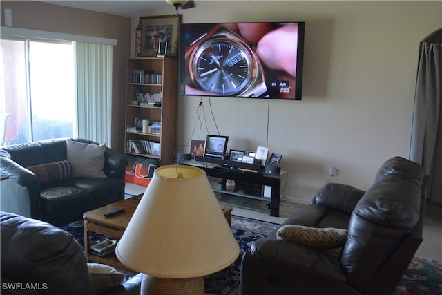 living room featuring carpet flooring and plenty of natural light