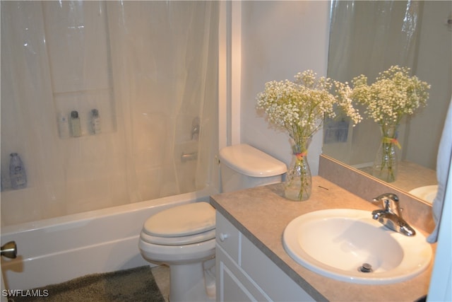 full bathroom with vanity, toilet, and shower / bath combination with curtain