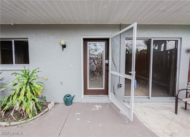 entrance to property featuring a patio area