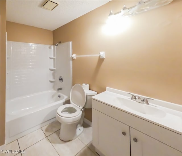 full bathroom featuring a textured ceiling, shower / washtub combination, toilet, tile patterned floors, and vanity