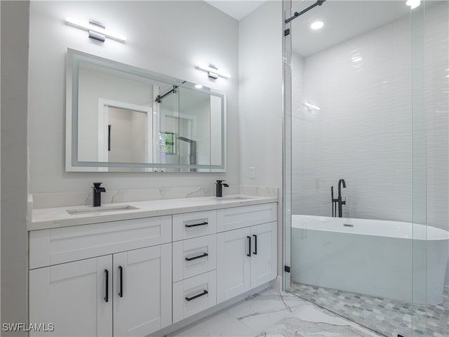 bathroom with vanity and a bathtub